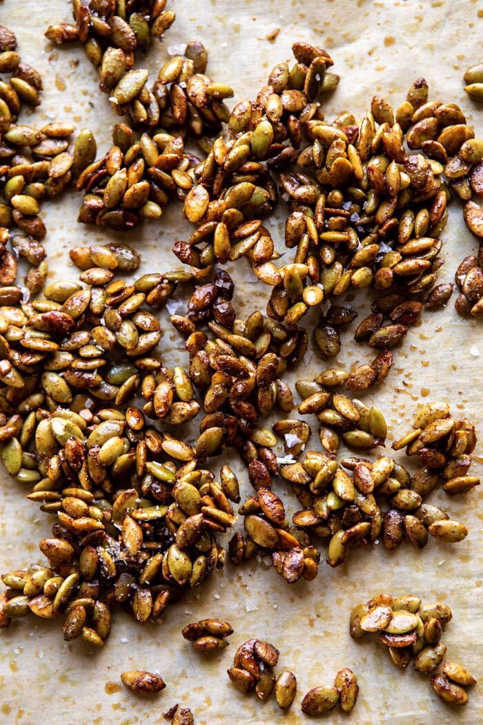 overhead photo of roast pumpkin seeds on baking sheet