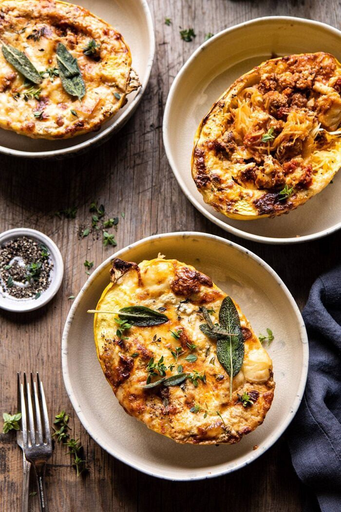 Roasted Garlic Spaghetti Squash Lasagna Boats | halfbakedharvest.com #healthyrecipes #spaghettisquash #fall #easyrecipes overhead photo of Roasted Garlic Spaghetti Squash Lasagna Boats with 3 bowls of squash in photo