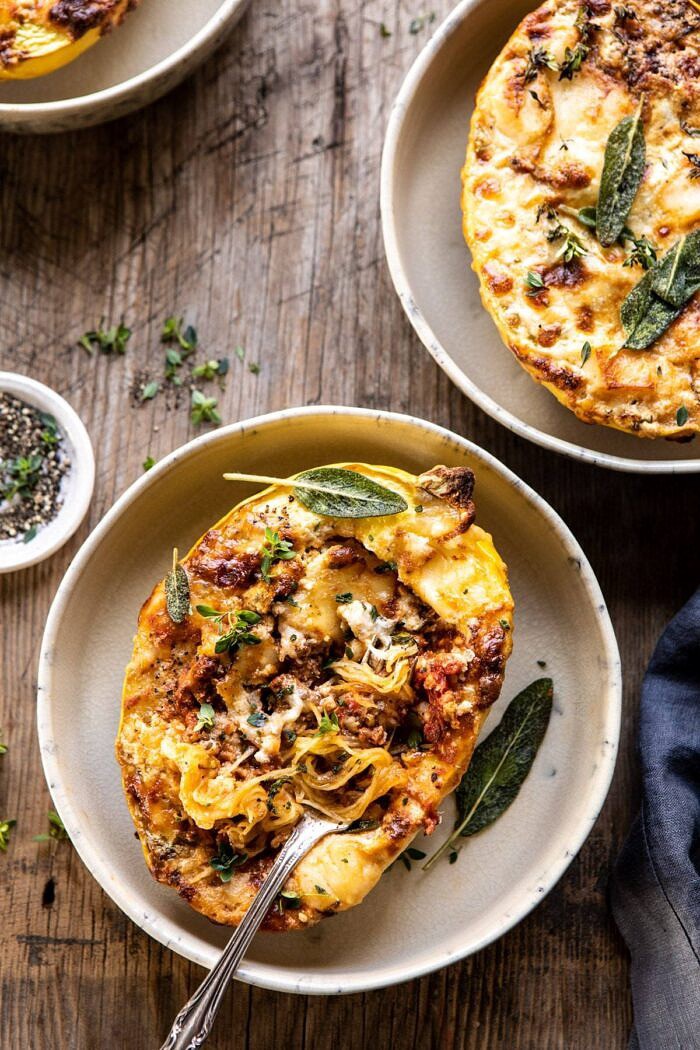 Roasted Garlic Spaghetti Squash Lasagna Boats | halfbakedharvest.com #healthyrecipes #spaghettisquash #fall #easyrecipes overhead photo of Roasted Garlic Spaghetti Squash Lasagna Boats with fork in spaghetti squash