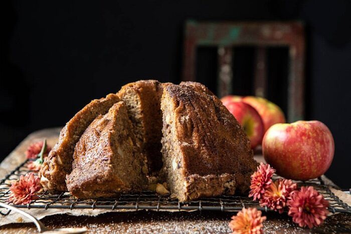 Spiced Pecan Apple Cider Doughnut Cake | halfbakedharvest.com #applecider #cake #easyrecipes #fall #autumn #baking horizontal photo of Spiced Pecan Apple Cider Doughnut Cake with pieces cut