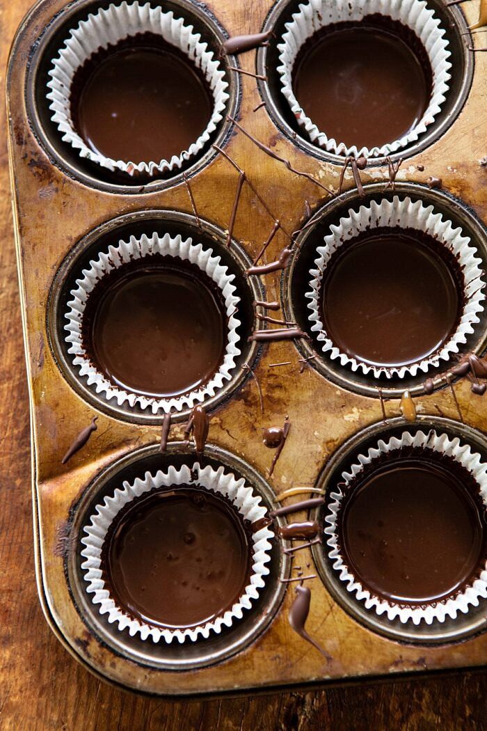 6 Ingredient Milk Chocolate Salted Caramel Cups | halfbakedharvest.com #chocolate #caramel #easy #fall overhead photo of Milk Chocolate before it's cooled
