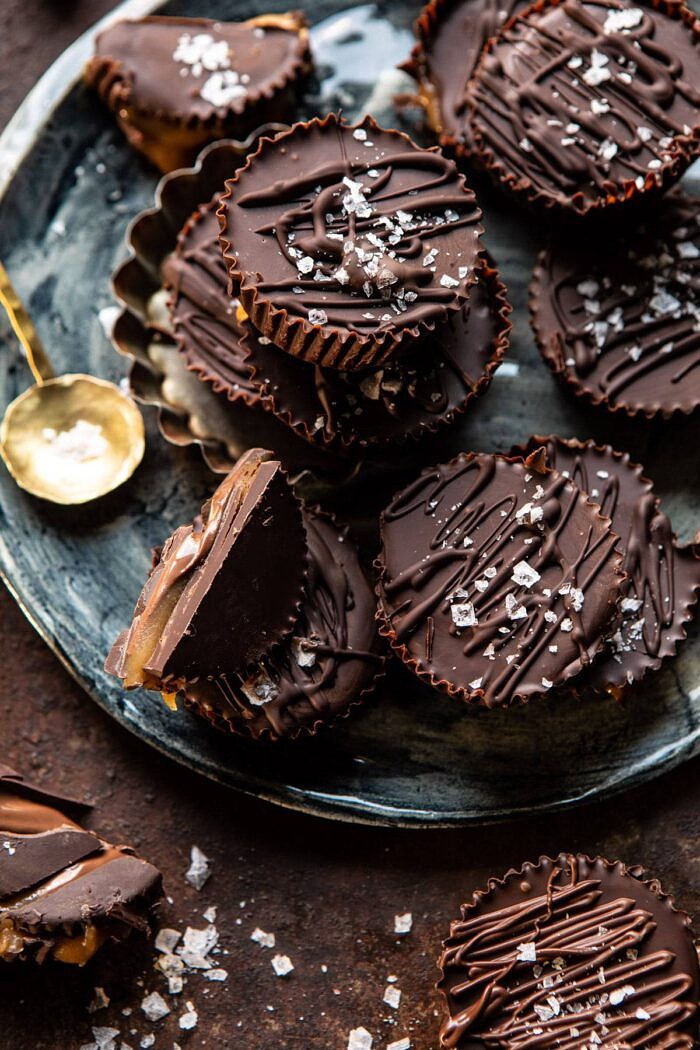 6 Ingredient Milk Chocolate Salted Caramel Cups | halfbakedharvest.com #chocolate #caramel #easy #fall overhead close up photo 6 Ingredient Milk Chocolate Salted Caramel Cups stacked on plate