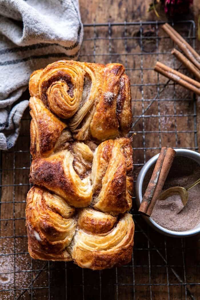 Easy Swirled Cinnamon Sugar Croissant Loaf | halfbakedharvest.com #cinnamon #fall #bread #croissants overhead close up photo of Easy Swirled Cinnamon Sugar Croissant Loaf before cutting