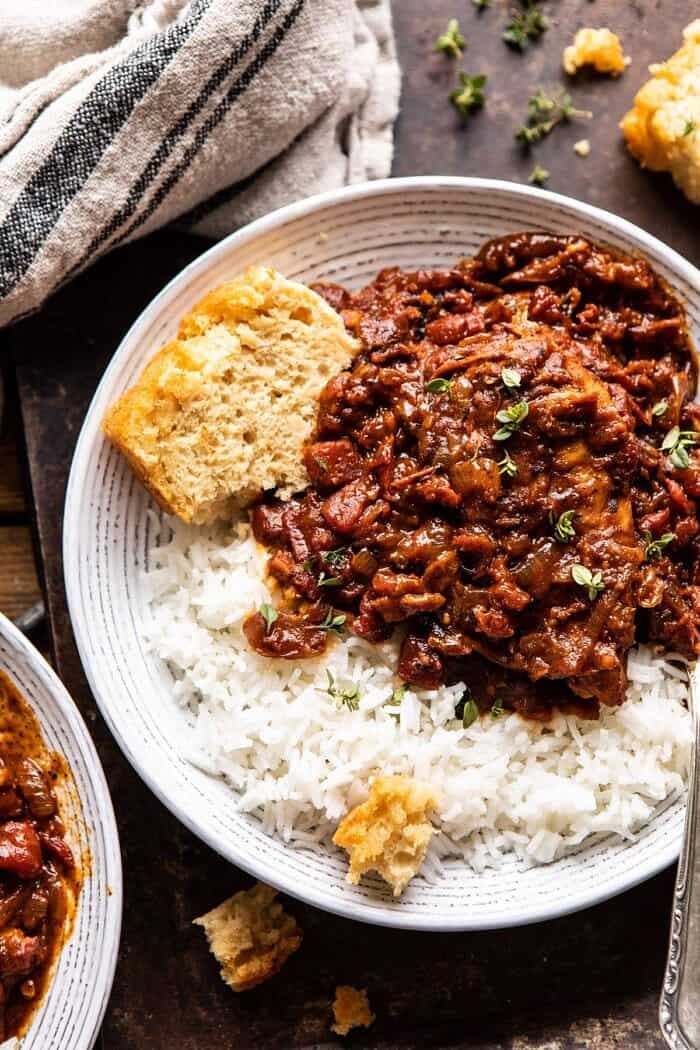 overhead close up photo of Healthier 30 Minute Beer Braised Chicken with towel and beer bread in photo 