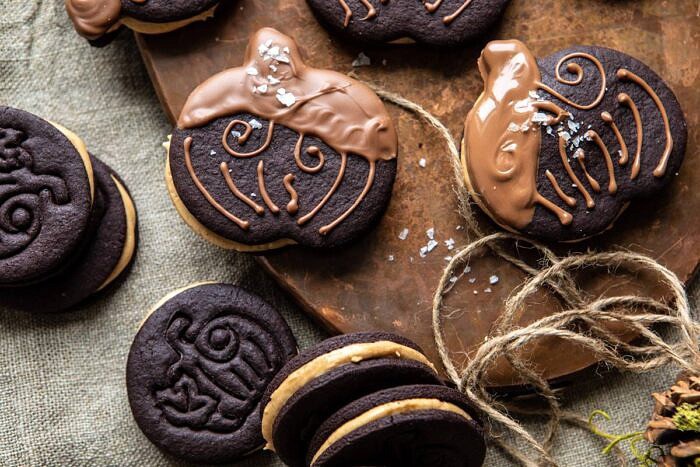 overhead horizontal photo of Peanut Butter Stuffed Chocolate Jack-O’-Lantern Cookies 