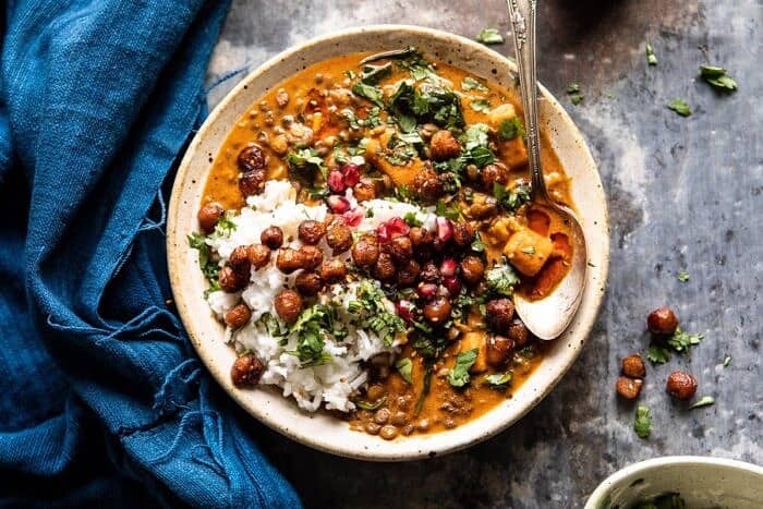Sweet Potato Lentil Curry with Crispy Sesame Chickpeas | halfbkaedharvest.com #healthy #vegan #easyrecipes #fallrecipes overhead horizontal photo of Sweet Potato Lentil Curry with Crispy Sesame Chickpeas