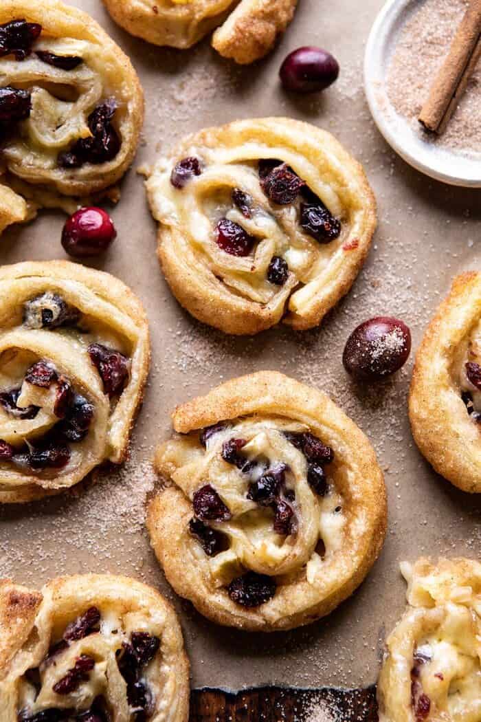 5 Ingredient Cranberry Brie Cinnamon Puff Pastry Swirls | halfbakedharvest.com #brie #cranberries #thanksgiving #christmas overhead close up photo of 5 Ingredient Cranberry Brie Cinnamon Puff Pastry Swirls