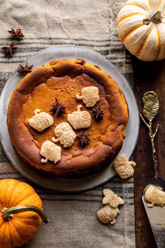 Burnt Basque Pumpkin Spice Cheesecake | halfbakedharvest.com #pumpkin #cheesecake #thanksgiving overhead photo of Burnt Basque Pumpkin Spice Cheesecake