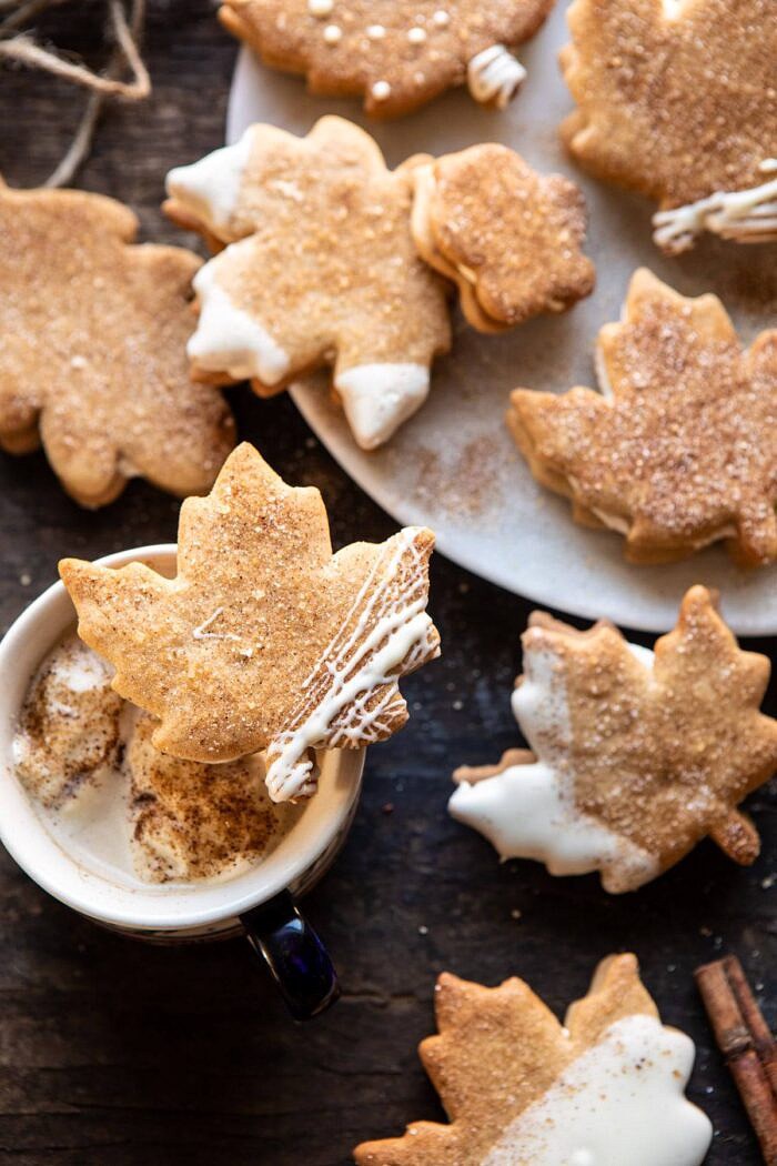 overhead photo of Chai Spiced Maple Sugar Cookie with Browned Butter Frosting resting on top of a mug of chai tea