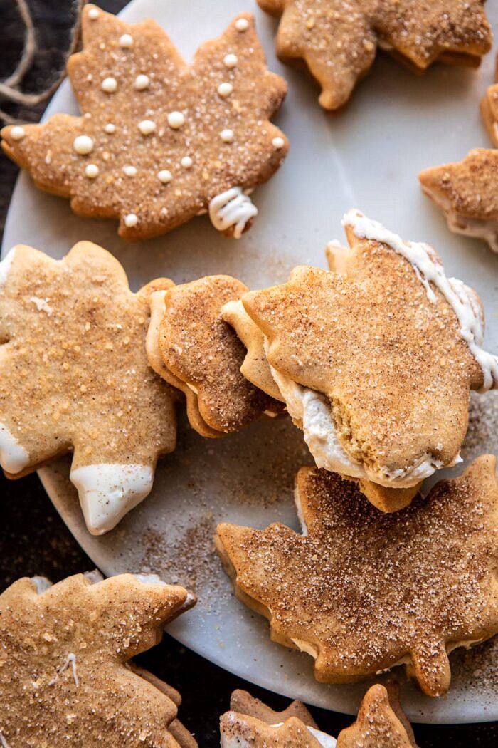 overhead photo of Chai Spiced Maple Sugar Cookie with Browned Butter Frosting broken in half to expose the filling 