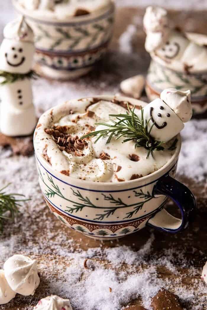 front on photo of Creamy Coconut Hot Chocolate with melting snowman marshmallow in hot cocoa