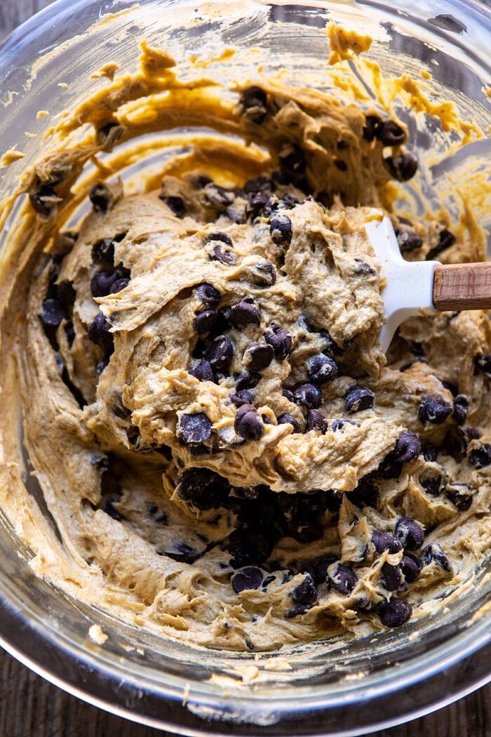 Gooey Chocolate Chip Cookie Pumpkin Pie | halfbakedharvest.com #cookiepie #thanksgiving #pumpkinpie overhead photo of Chocolate Chip Cookie Pumpkin Pie dough in mixing bowl