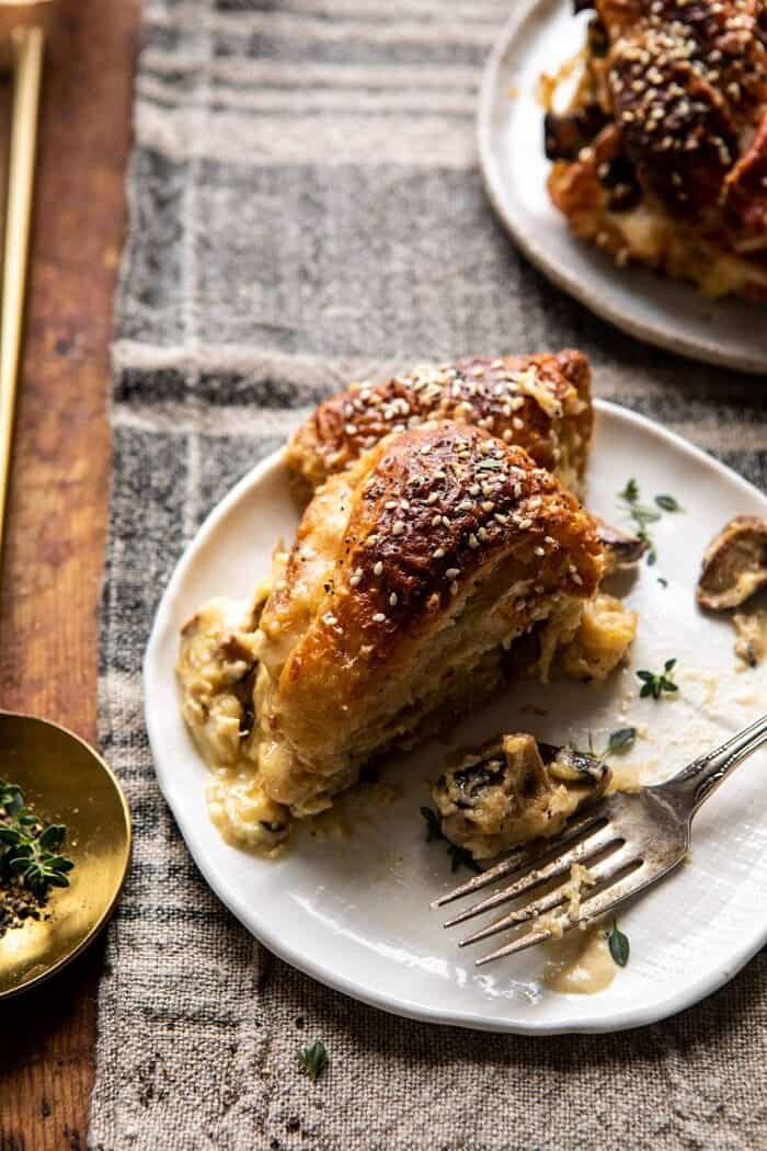 Ham and Cheese Croissant Bake | halfbakedharvest.com #brunch #breakfast #holiday #Christmas Ham and Cheese Croissant Bake on plate with fork