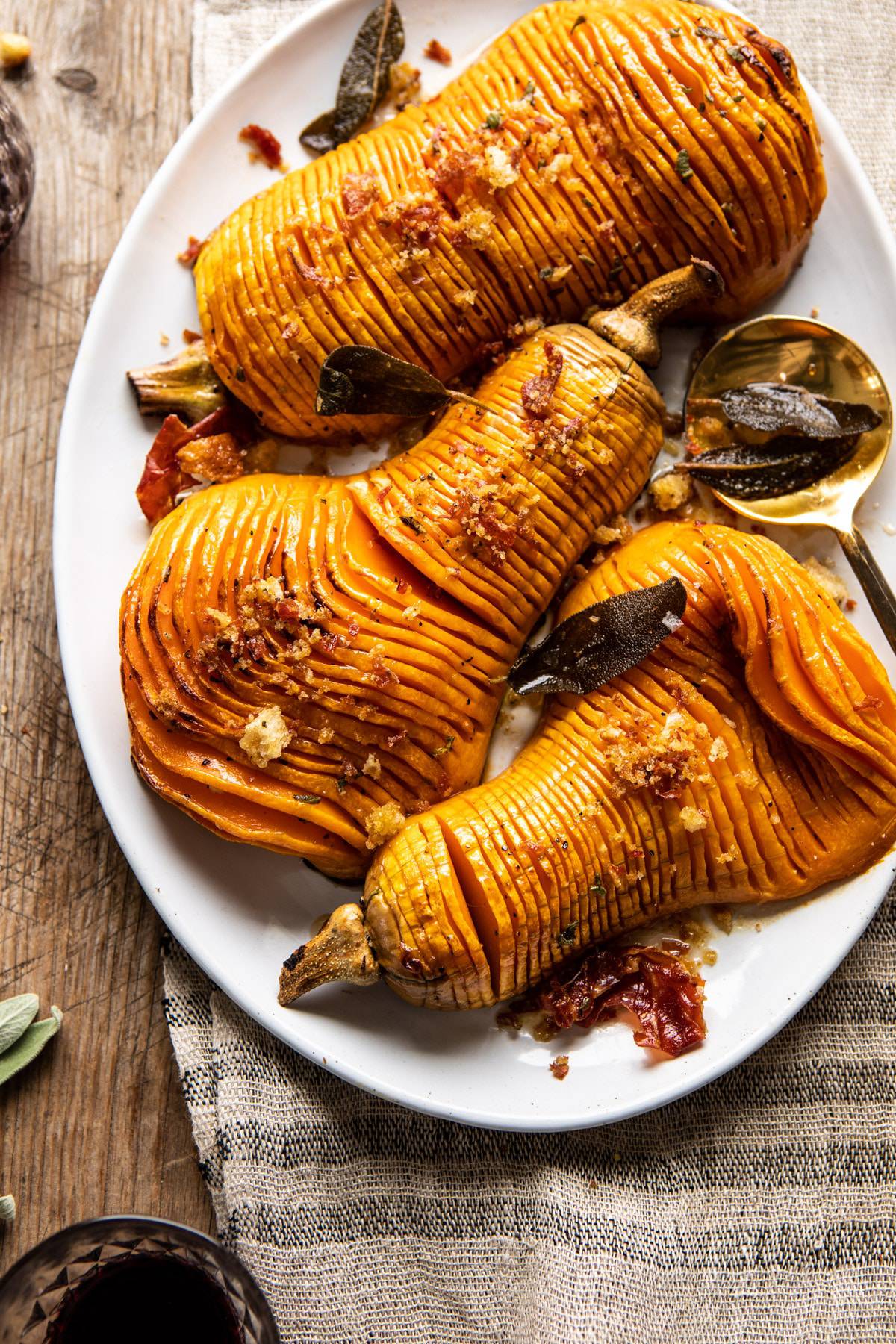 Hasselback Butternut Squash with Sage Butter and Prosciutto Breadcrumbs | halfbakedharvest.com #thanksgiving #sidedishes #butternutsquash