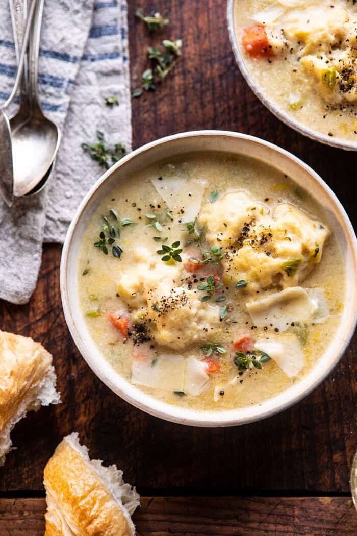 One Pot Creamy Turkey and Potato Dumplings | halfbakedharvest.com #turkey #dumplings #thanksgiving overhead close up photo of One Pot Creamy Turkey and Potato Dumplings in soup bowls