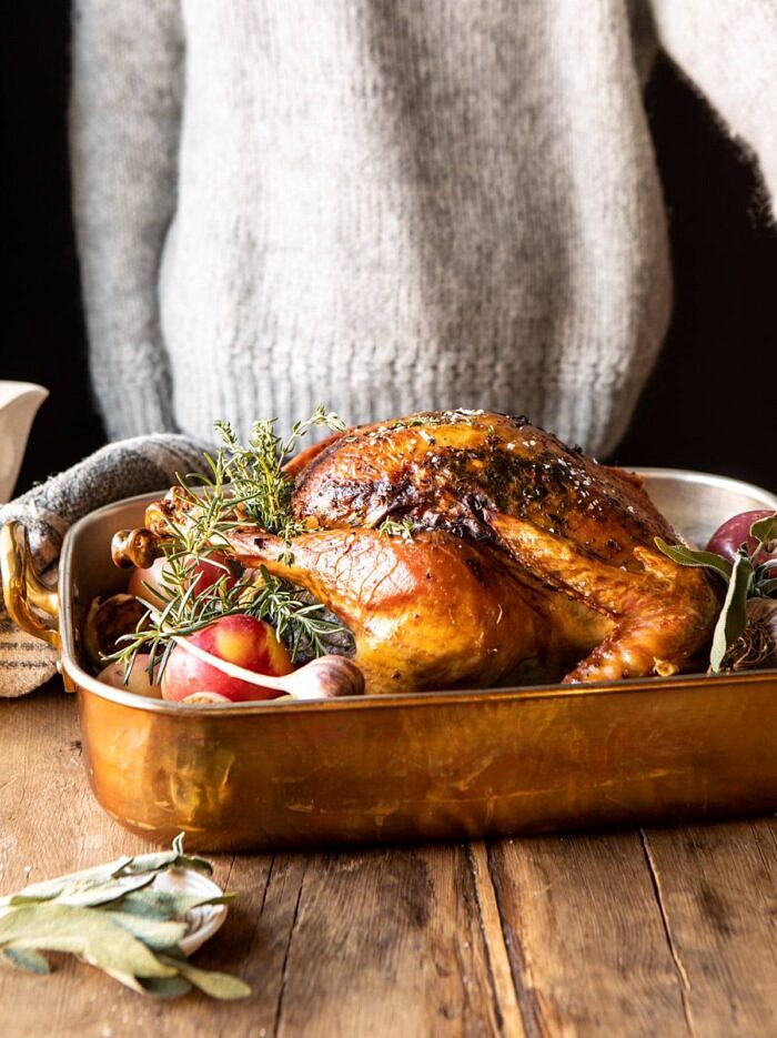 Our 2019 Thanksgiving Menu and Guide | halfbakedharvest.com #thanksgiving #thanksgivingmenu #holiday side angled photo of herb roasted turkey