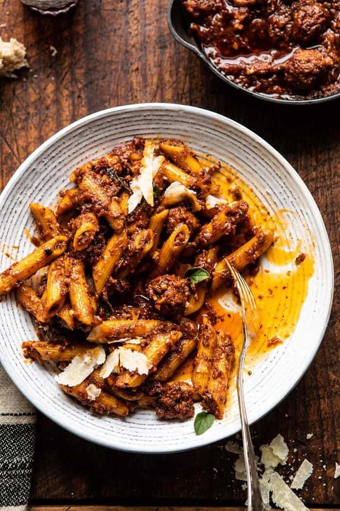 overhead close up photo of Best Super Easy Penne…with a lot of garlic with fork in serving bowl