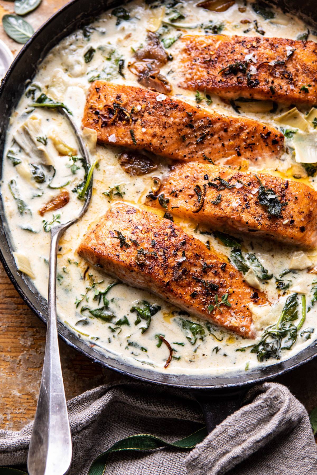 Creamy Spinach and Artichoke Salmon | halfbakedharvest.com #salmon #garlicbutter #easyrecipes