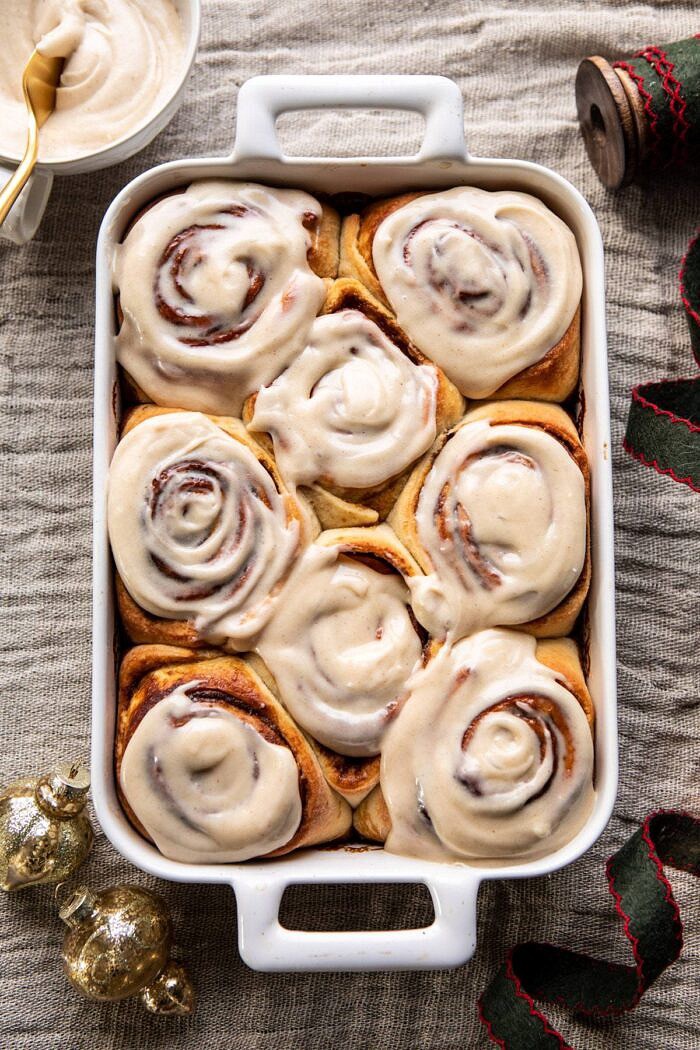 Easy Gingerbread Brioche Cinnamon Rolls | halfbakedharvest.com #cinnamonrolls #gingerbread overhead photo of Easy Gingerbread Brioche Cinnamon Rolls with frosting on rolls