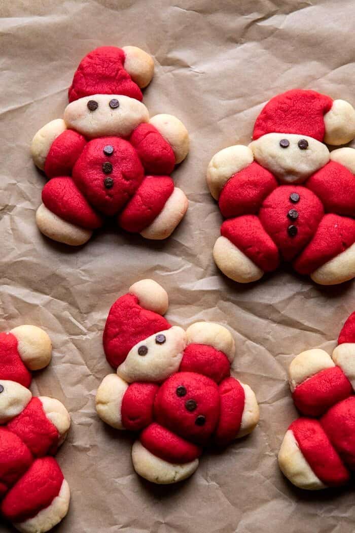 Holly Jolly Santa Cookies | halfbakedharvest.com #santacookies #sugarcookies overhead photo of Holly Jolly Santa Cookies after baking on baking sheet