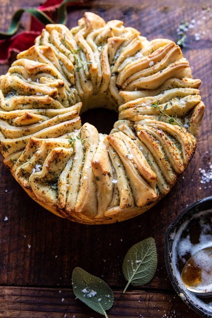 Pull-Apart Garlic Butter Bread Wreath | halfbakedharvest.com #garlicbread #Christmas side angled close up photo of Pull-Apart Garlic Butter Bread Wreath