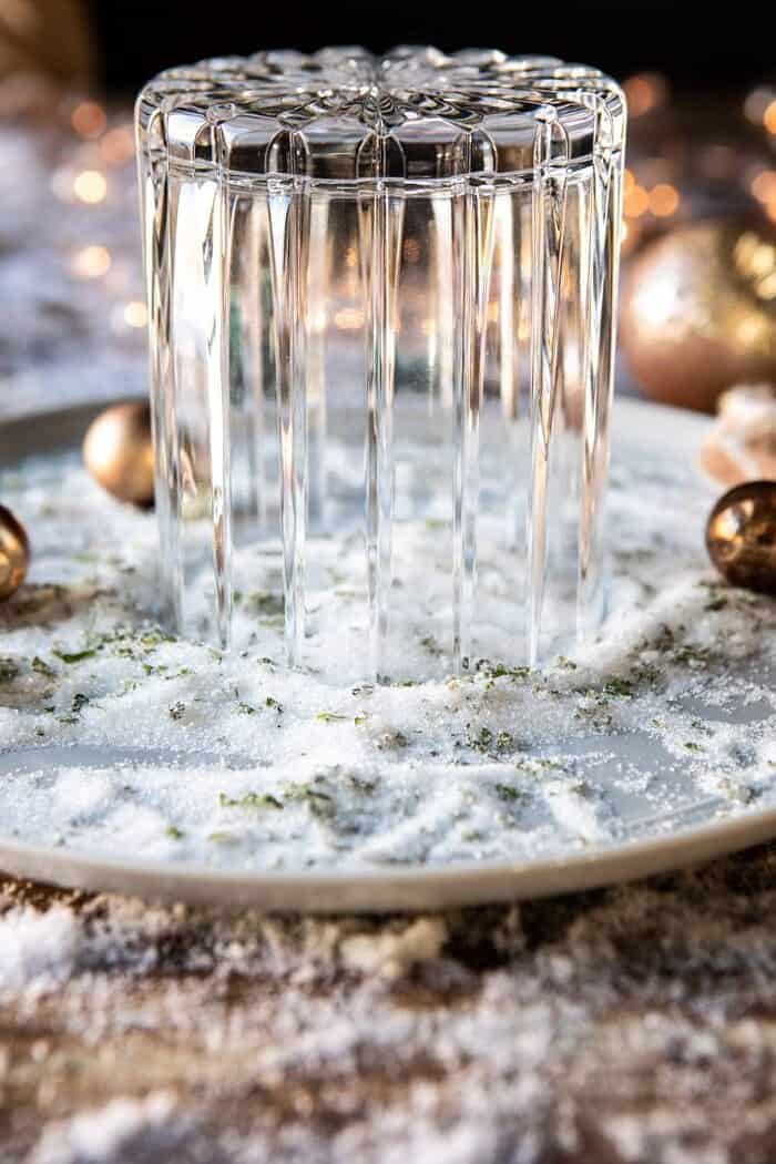 rimming cocktail glass in mint sugar