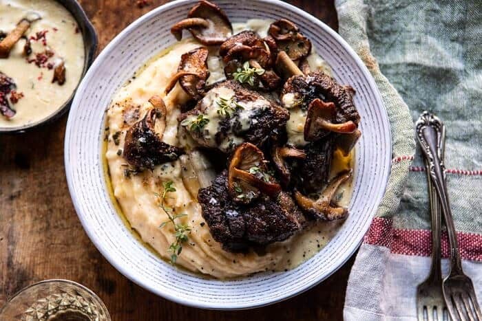 White Wine Braised Short Ribs with Buttered Mushroom Cream Sauce | halfbakedharvest.com #slowcooker #crockpot #shortribs #holiday #christmas horizontal photo of White Wine Braised Short Ribs with Buttered Mushroom Cream Sauce