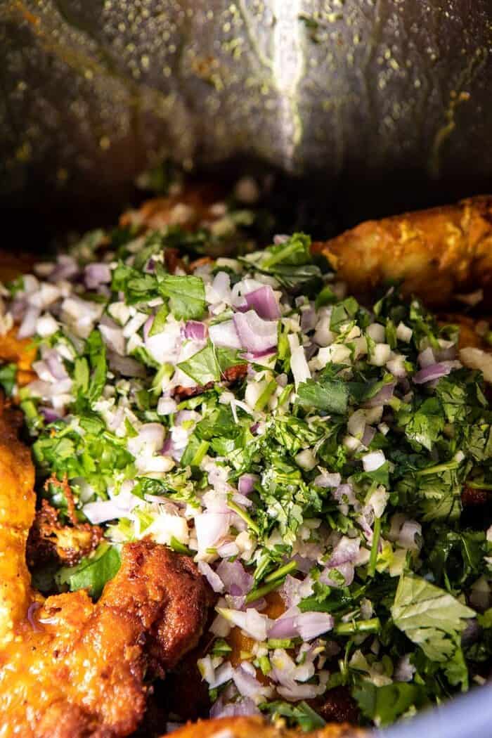 30 Minute Coconut Milk Braised Chicken with Sweet Potatoes and Rice | halfbakedharvest.com #instantpot #easyrecipes #healthy chicken and herbs in instant pot