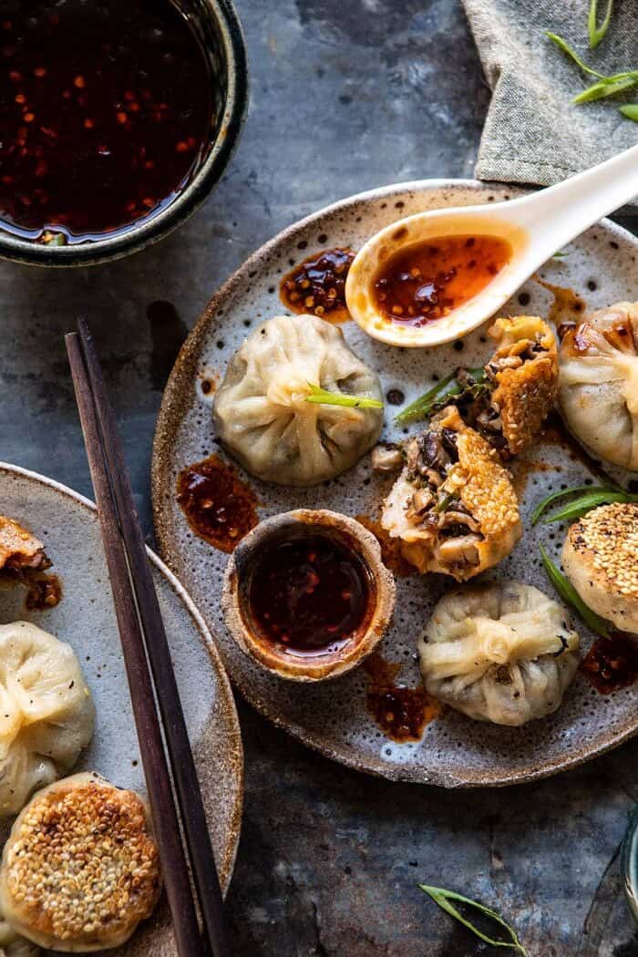 Chinese Mushroom Dumplings with Sweet Chili Ginger Sesame Sauce | halfbakedharvest.com #dumplings #potstickers #chinese overhead photo of Chinese Mushroom Dumplings with Sweet Chili Ginger Sesame Sauce and the dumplings torn in half
