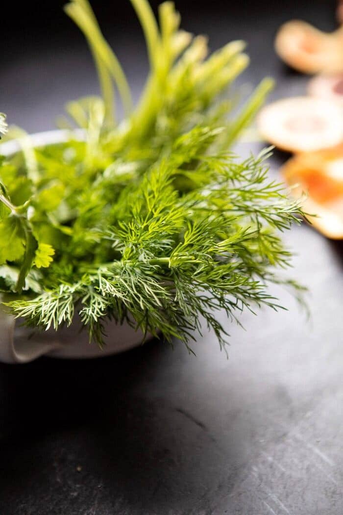 Eggs in Purgatory with Chile Butter and Feta | halfbakedharvest.com #breakfastrecipe #eggs fresh herbs in bowl