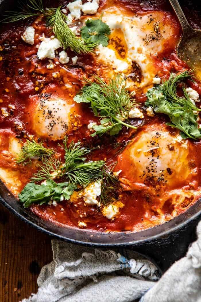 Eggs in Purgatory with Chile Butter and Feta | halfbakedharvest.com #breakfastrecipe #eggs overhead close up photo of Eggs in Purgatory with Chile Butter and Feta