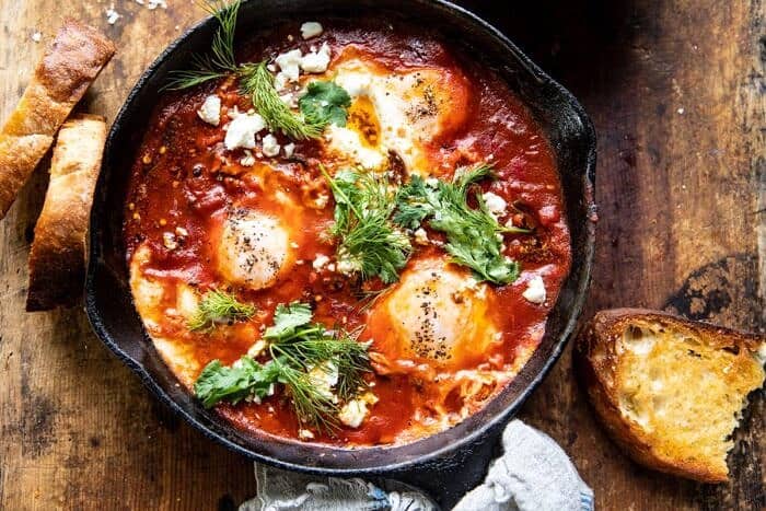 Eggs in Purgatory with Chile Butter and Feta | halfbakedharvest.com #breakfastrecipe #eggs overhead horizontal photo of Eggs in Purgatory with Chile Butter and Feta
