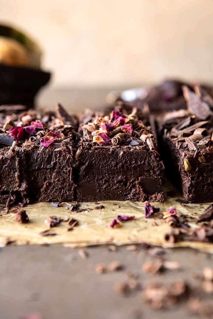 Fudgy Avocado Brownies with Chocolate Fudge Frosting | halfbakedharvest.com #brownies #healthy side angled photo of Fudgy Avocado Brownies with Chocolate Fudge Frosting