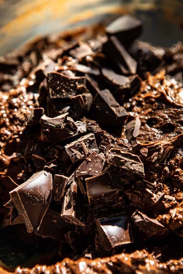 Fudgy Avocado Brownies with Chocolate Fudge Frosting | halfbakedharvest.com #brownies #healthy brownie batter in mixing bowl with chocolate chunks