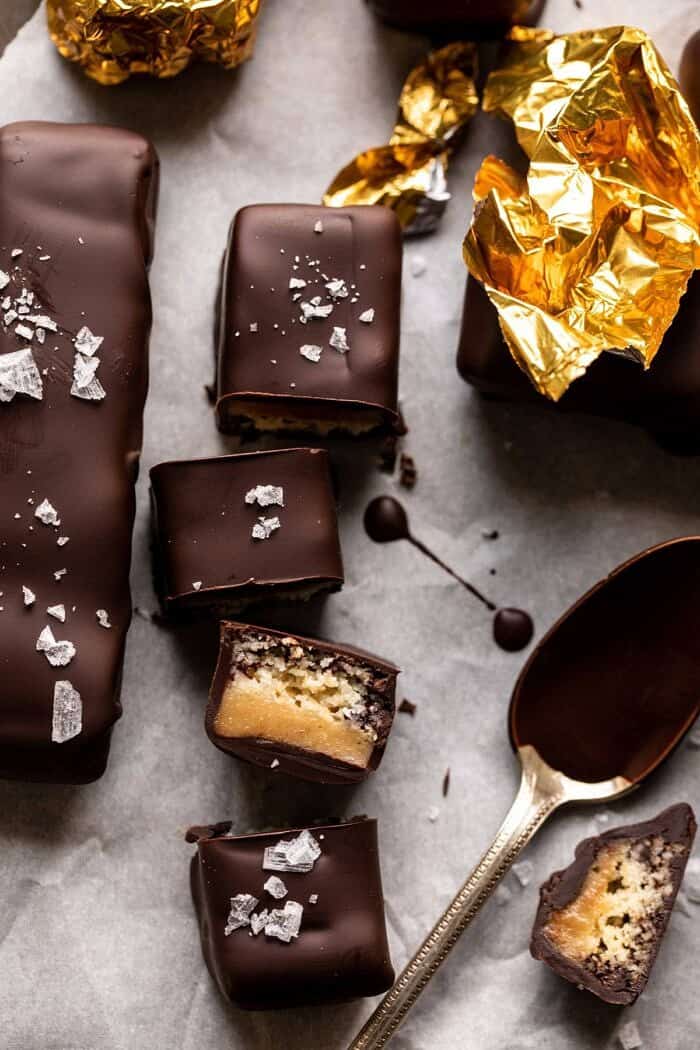 Homemade Vegan Twix Bars | halfbakedharvest.com #vegan #chocolatebar overhead photo of Homemade Vegan Twix Bar cut into 4 pieces to expose the center