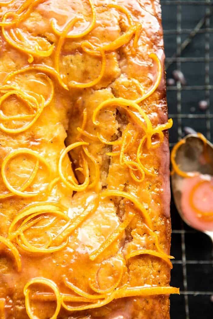 Lemon Poppyseed Cake with Citrus Honey Glaze | halfbakedharvest.com #lemon #cake #winter overhead close up photo of Lemon Poppyseed Cake with Citrus Honey Glaze