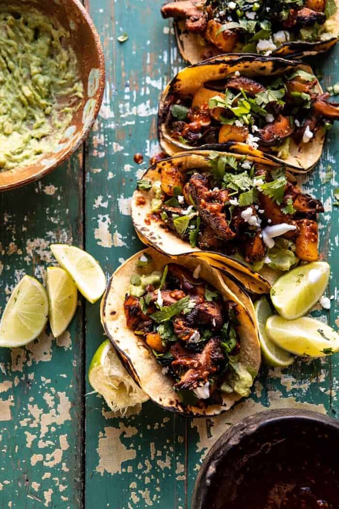 Mushroom Al Pastor Tacos with Garlic Lime Special Sauce | halfbakedharvest.com #vegan #mushrooms #tacos overhead photo of Mushroom Al Pastor Tacos with Garlic Lime Special Sauce