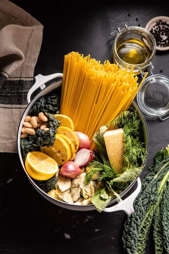 One Pot Creamy Tuscan Pesto and Artichoke Pasta | halfbakedharvest.com #onepot #pasta overhead photo of One Pot Creamy Tuscan Pesto and Artichoke Pasta before cooking