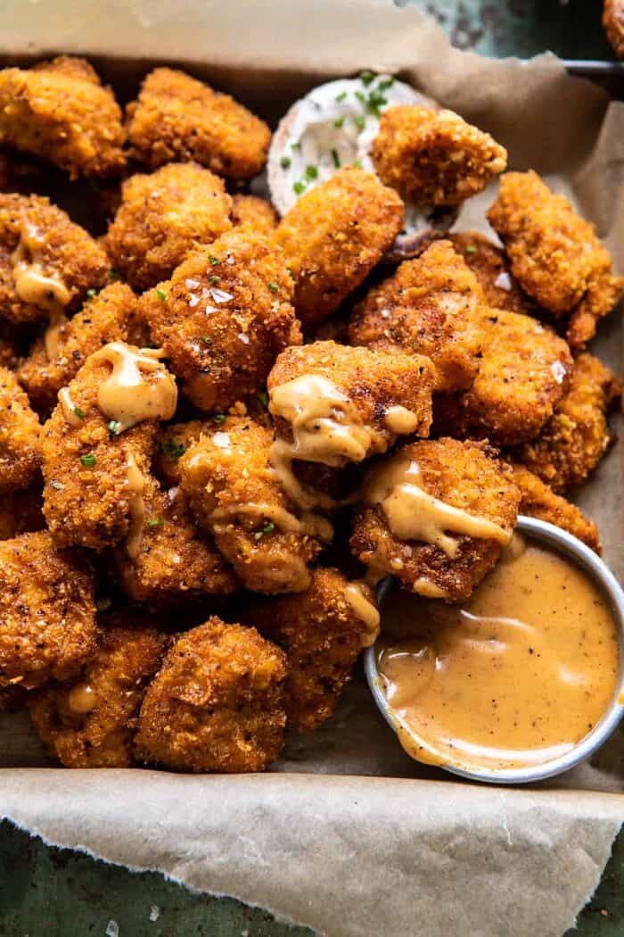 Oven Fried Cajun Popcorn Chicken with Creamy Honey Mustard | halfbakedharvest.com #chickenfingers #easyrecipes overhead close up photo of Oven Fried Cajun Popcorn Chicken with Creamy Honey Mustard