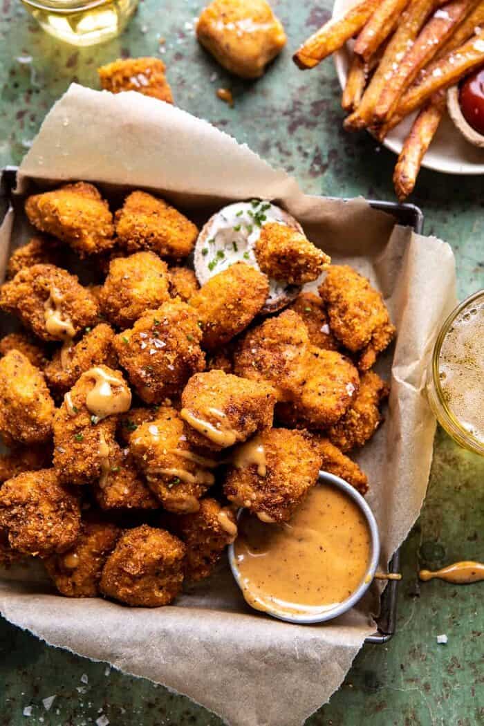 Oven Fried Cajun Popcorn Chicken with Creamy Honey Mustard | halfbakedharvest.com #chickenfingers #easyrecipes