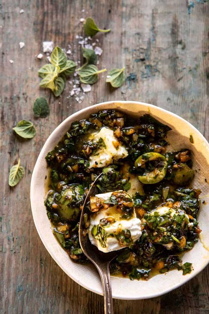 Roasted Garlic Butter Chicken with Lemon Olive Dressing | halfbakedharvest.com #chicken #sheetpan #easyrecipes Lemon Olive Dressing in bowl with goat cheese