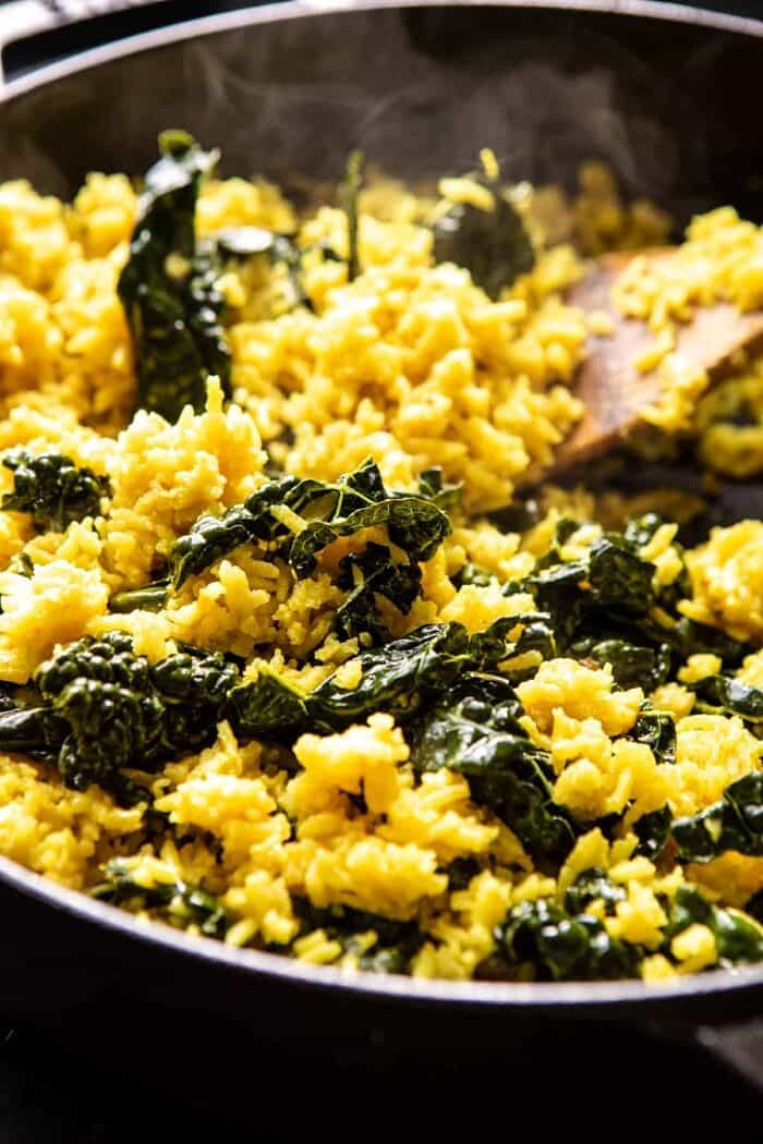 Creamy Golden Rice cooking in pot