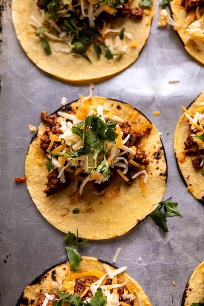 Crispy Chipotle Chicken Tacos with Cilantro Lime Ranch | halfbakedharvest.com stuffing the tacos shells with Chipotle Chicken Taco meat and cheese
