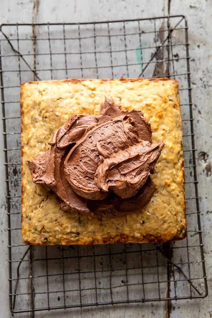 overhead prep photo of Easiest Coconut Banana Cake with a blob of frosting on top, before spreading 