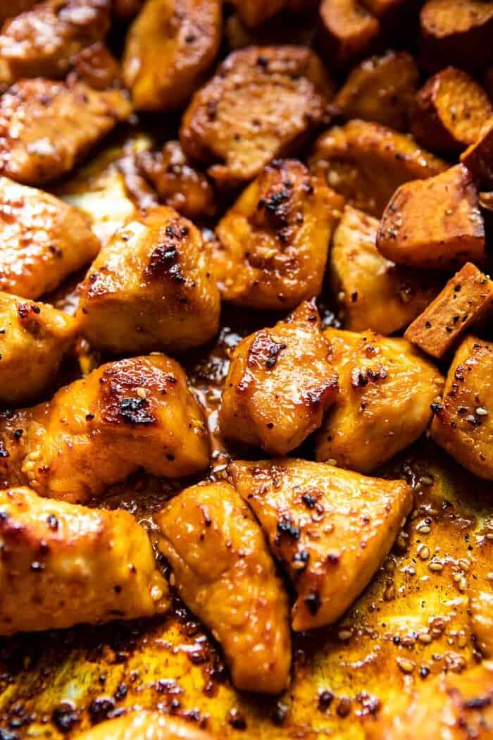 Sheet Pan Korean Chicken Bowl with Sweet Potatoes and Yum Yum Sauce | halfbakedharvest.com #sheetpan #korean close up photo of Sheet Pan Korean Chicken on sheet pan after roasting