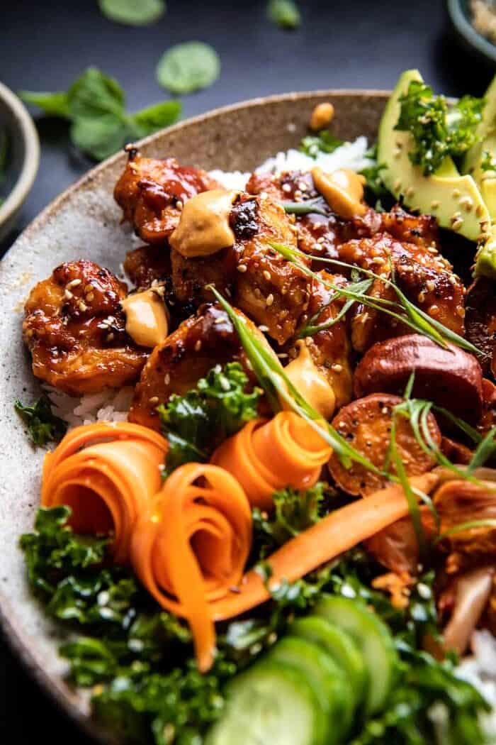 Sheet Pan Korean Chicken Bowl with Sweet Potatoes and Yum Yum Sauce | halfbakedharvest.com #sheetpan #korean side angled close up photo of Sheet Pan Korean Chicken Bowl with Sweet Potatoes and Yum Yum Sauce