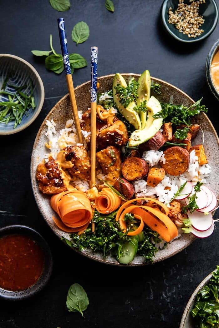 Sheet Pan Korean Chicken Bowl with Sweet Potatoes and Yum Yum Sauce | halfbakedharvest.com #sheetpan #korean overhead photo of Sheet Pan Korean Chicken Bowl with Sweet Potatoes and Yum Yum Sauce with chop sticks in bowl