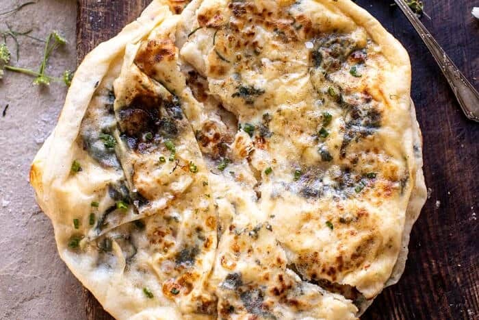 Cheesy Herb Stuffed Naan | halfbakedharvest.com overhead horizontal photo of Cheesy Herb Stuffed Naan