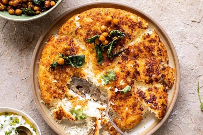 Crispy Persian Rice (Tahdig) with Spiced Golden Chickpeas | halfbakedharvest.com overhead horizontal photo of Crispy Persian Rice (Tahdig) with Spiced Golden Chickpeas