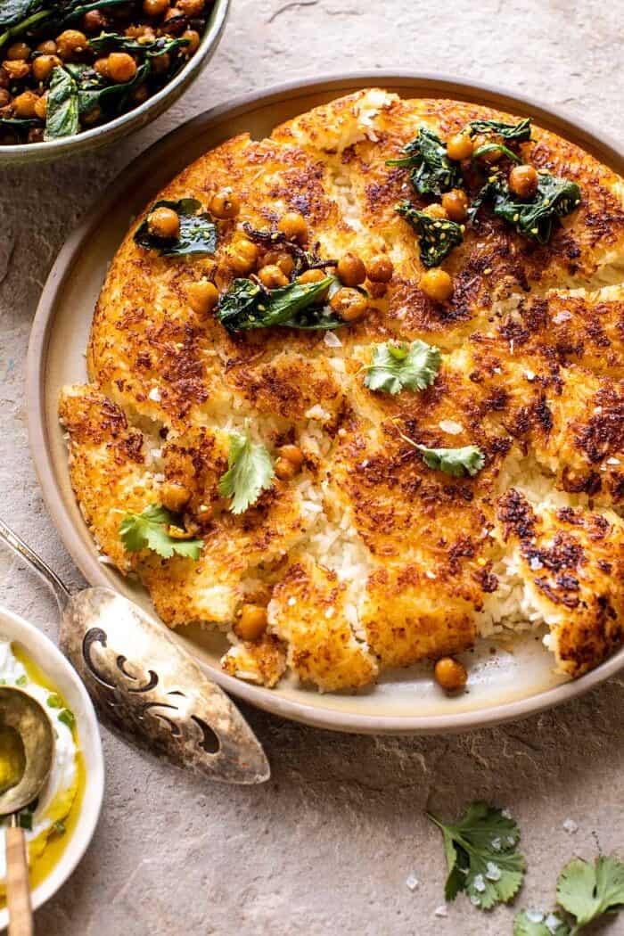 Crispy Persian Rice (Tahdig) with Spiced Golden Chickpeas | halfbakedharvest.com side angled photo of Crispy Persian Rice (Tahdig) with Spiced Golden Chickpeas